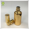 Garrafa luxuosa da bomba da imprensa do ouro do vidro 50ml geado com bomba do ouro